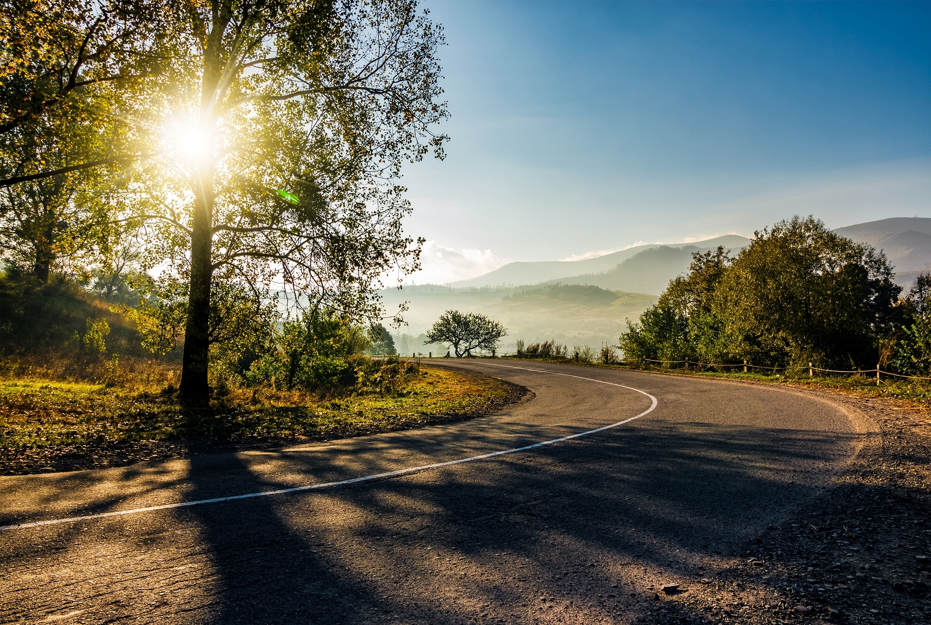 countryside-road-down-to-the-valley-at-sunrise-be-2026-01-09-14-33-11-utc 1