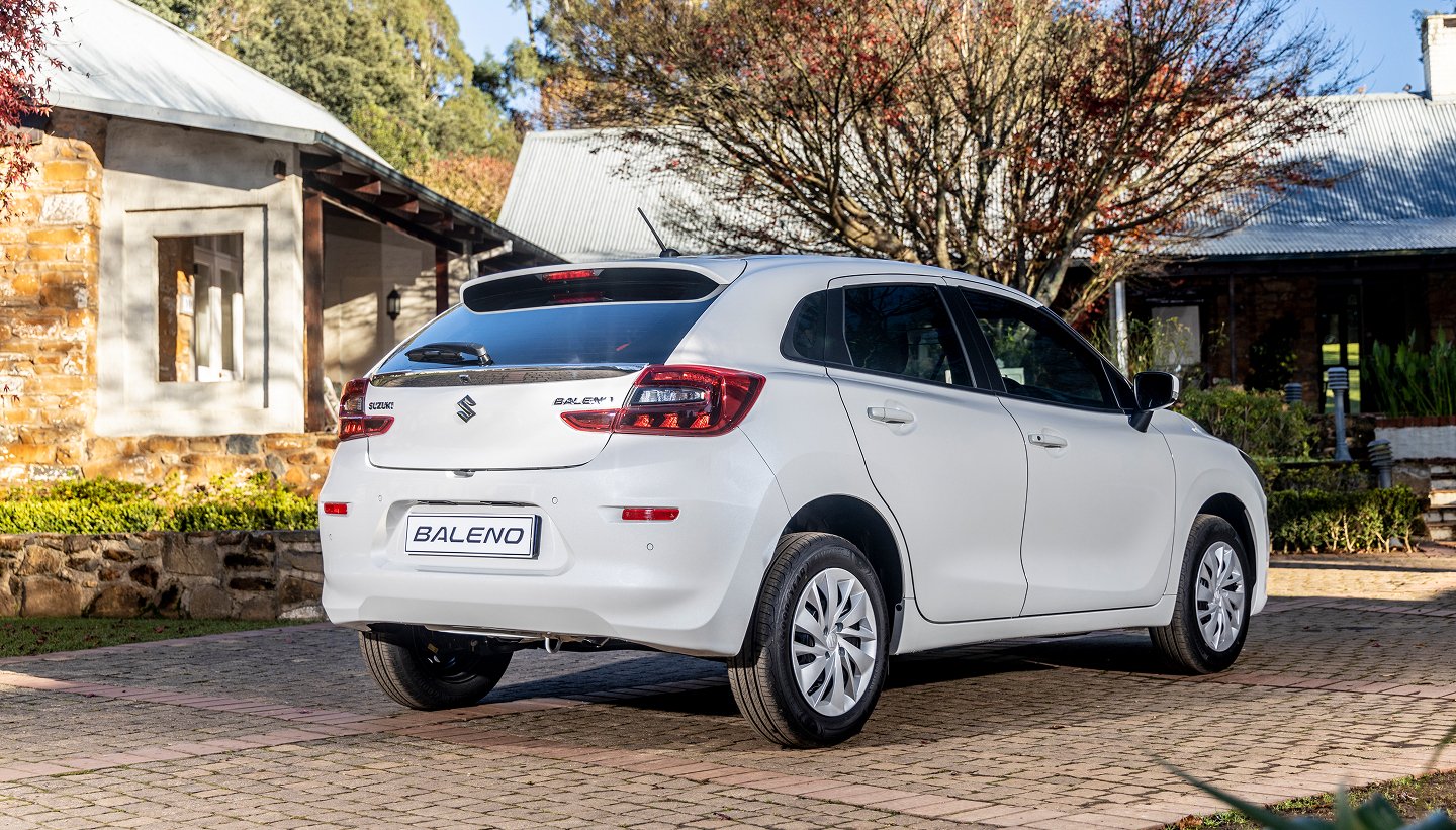 Suzuki Baleno_White From Behind In Front Of House